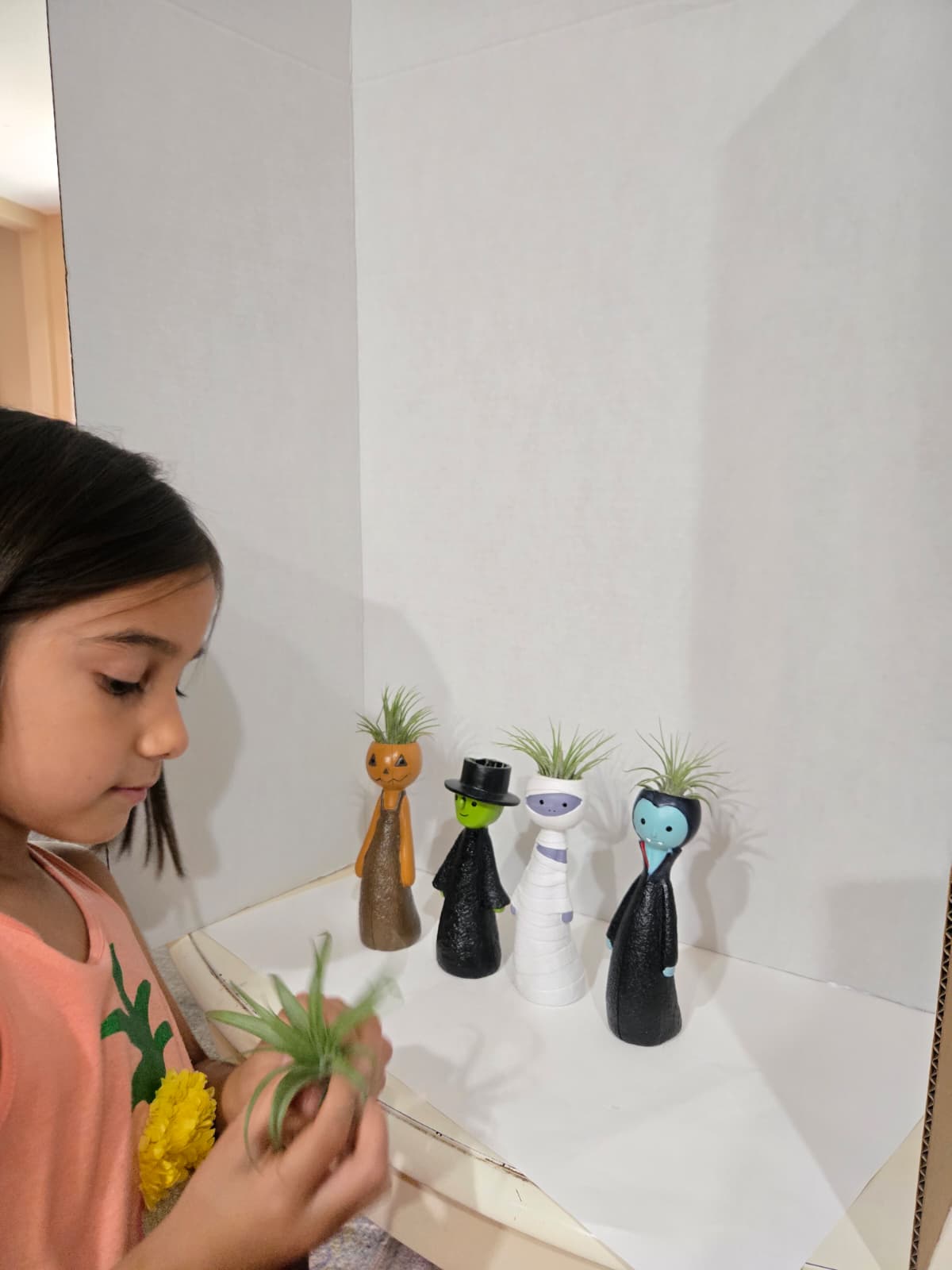 Isabella setting up her shop